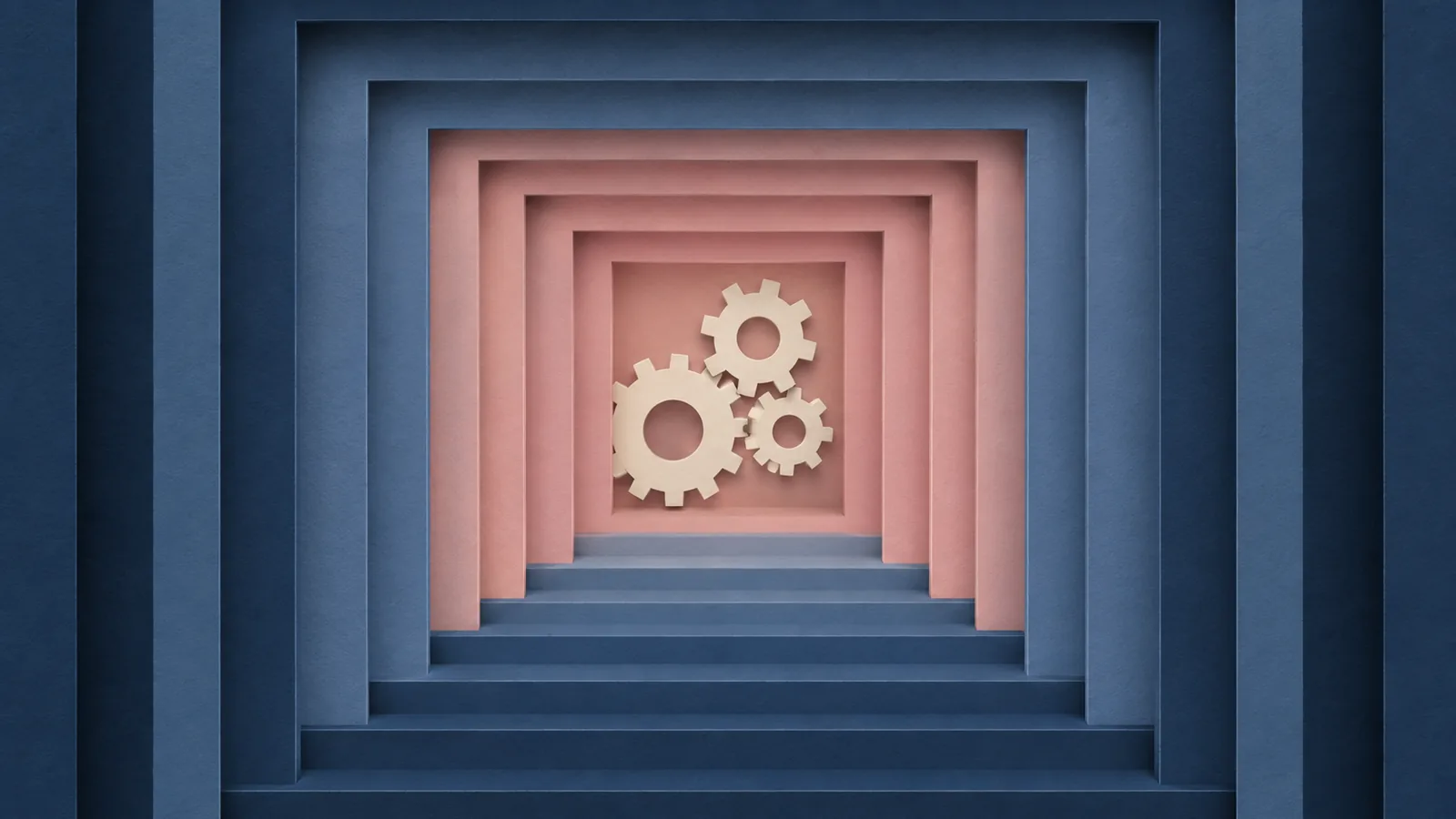 Paper-cut illustration of a set of three interlocking gears